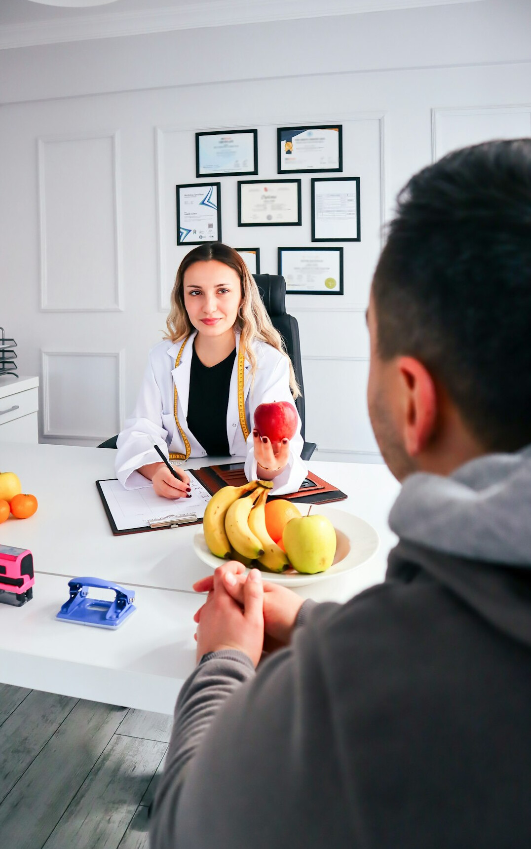 doctor explaining insurance plan to patient
