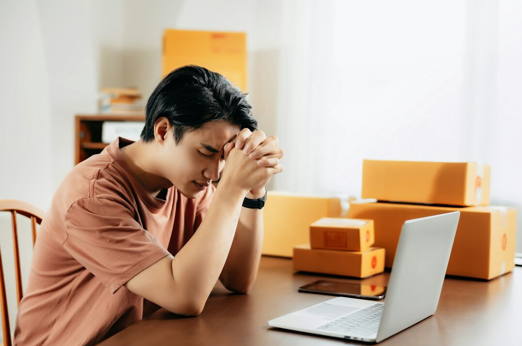 Man submitting a health insurance claim online using a laptop