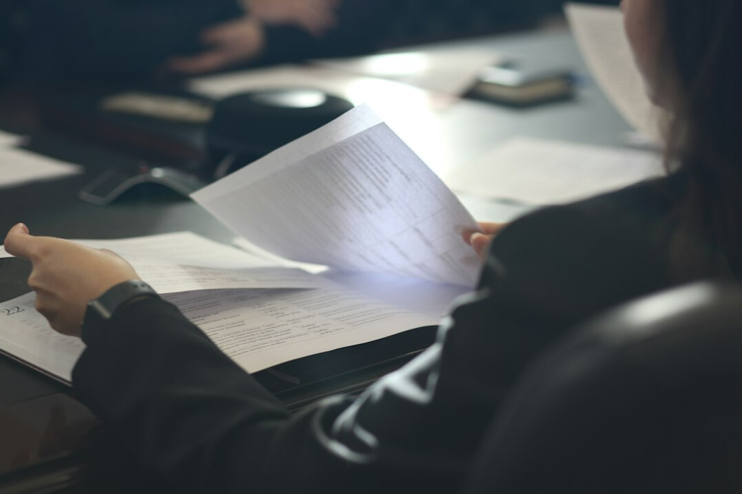 person reviewing insurance paperwork