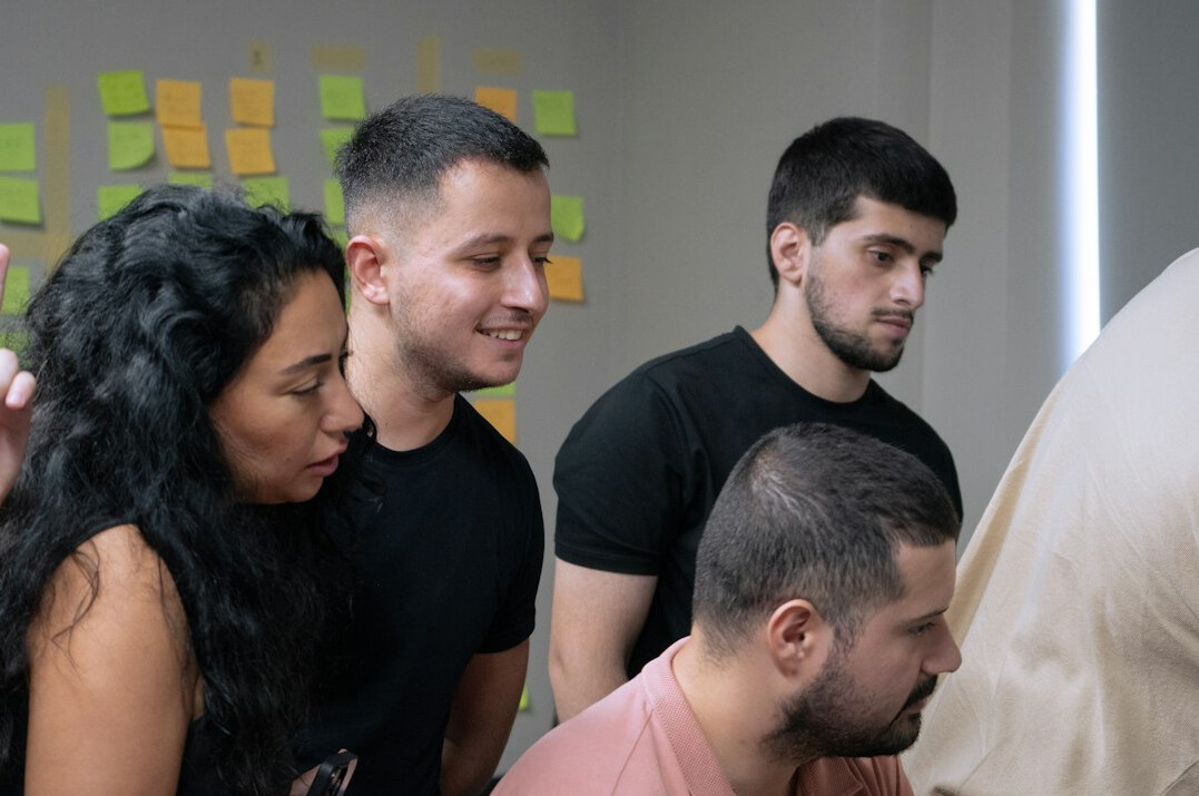 diverse young adults discussing options