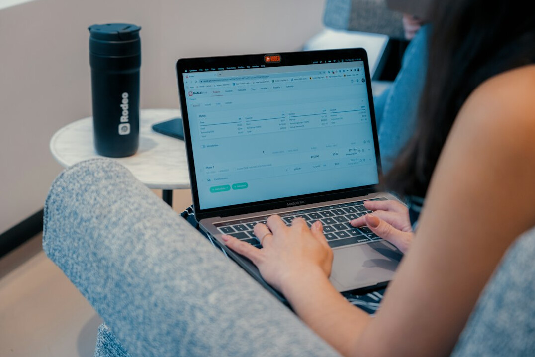 person comparing medical costs on laptop